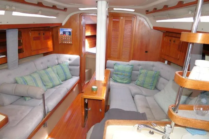 Slide: The Image of Interior of 1989 C&C 37/40+ sailboat with cozy seating and wooden cabinetry. - 2