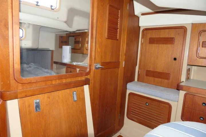 Slide: The Image of Interior of a 1989 C&C 37/40+ sailboat with wooden cabinetry and seating. - 33