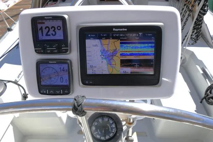 Slide: The Image of Cockpit navigation instruments on a 1989 C&C 37/40+ sailboat, featuring Raymarine displays. - 40