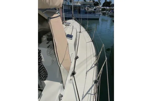Slide: The Image of 1989 C&C 37/40+ sailboat deck view in marina setting. - 47