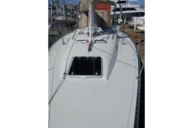 Slide: The Image of 1989 C&C 37/40+ sailboat docked at marina, view of deck and hatch. - 51
