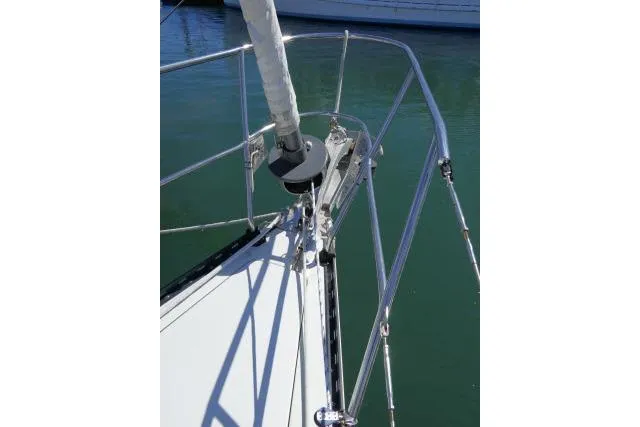 Slide: The Image of Bow of 1989 C&C 37/40+ sailboat with stainless steel railing and furled sail. - 53