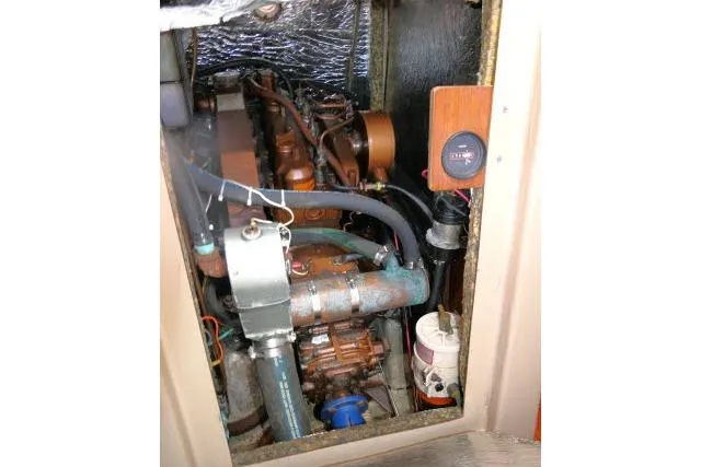 Slide: The Image of Engine compartment of a 1989 C&C 37/40+ sailboat, showing mechanical components and wiring. - 61