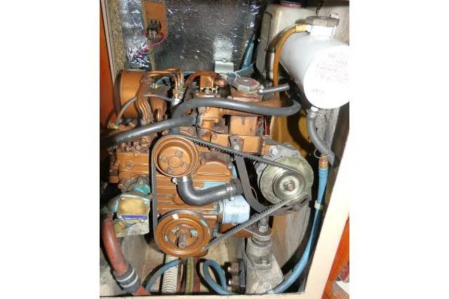 Slide: The Image of 1989 C&C 37/40+ engine compartment with visible components and wiring. - 62