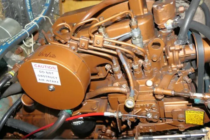 Slide: The Image of Engine of a 1989 C&C 37/40+ sailboat with visible air intake warning. - 63