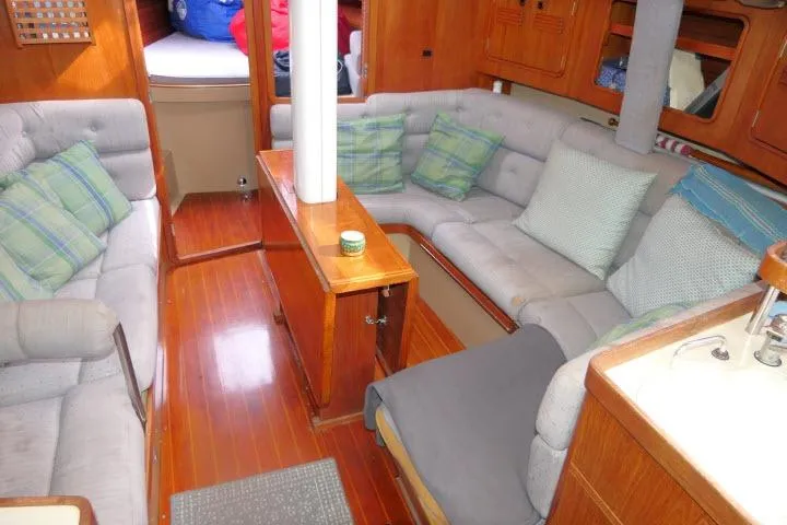 Slide: The Image of Interior of 1989 C&C 37/40+ sailboat with cozy seating and wooden finishes. - 9