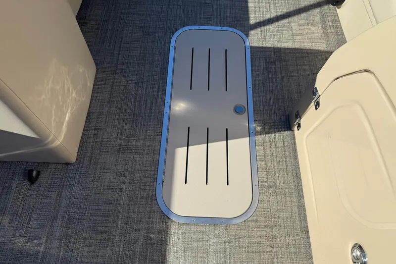 Slide: The Image of 2026 Bentley Pontoons Legacy 243 Navigator interior floor hatch detail. - 13