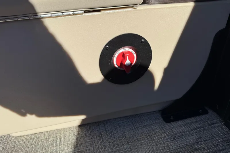 Slide: The Image of Battery switch on 2026 Bentley Pontoons Legacy 243 Navigator, beige interior detail. - 16