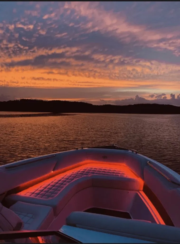 Slide: The Image of Cobalt R7 boat at sunset on calm water, 2021 model. - 13