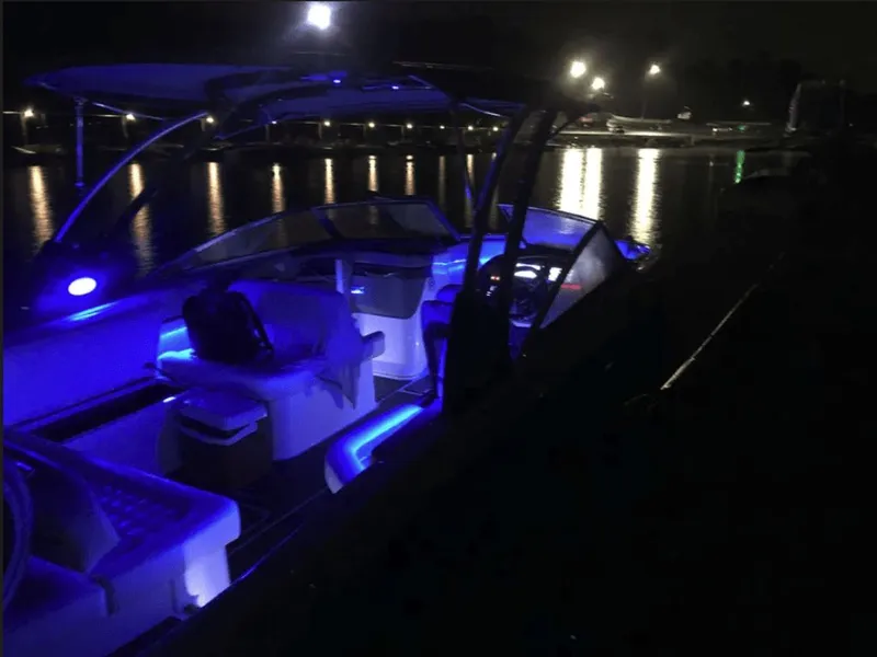 Slide: The Image of 2021 Cobalt R7 boat with blue lighting at night. - 14