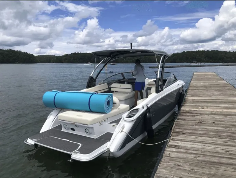 Slide: The Image of 2021 Cobalt R7 boat docked, sleek design. - 2