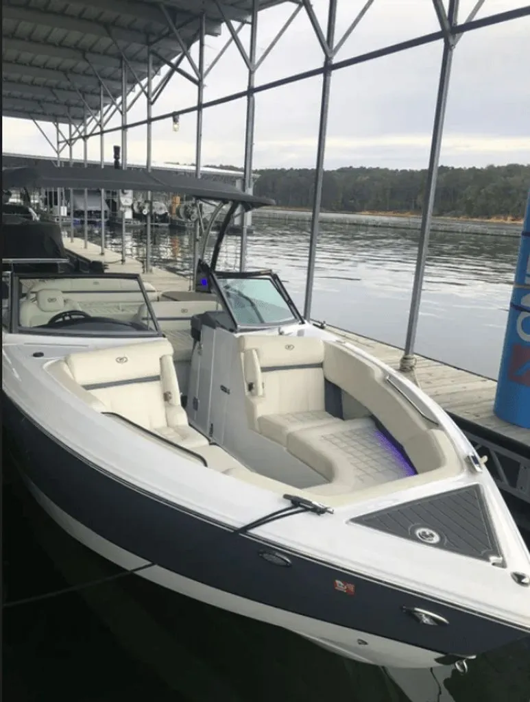 Slide: The Image of 2021 Cobalt R7 boat cockpit with modern instruments and steering wheel. - 4