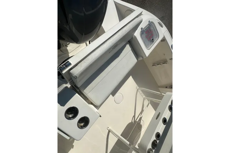 Slide: The Image of 2023 Cobia 220 Center Console boat interior with seating and storage compartments. - 18