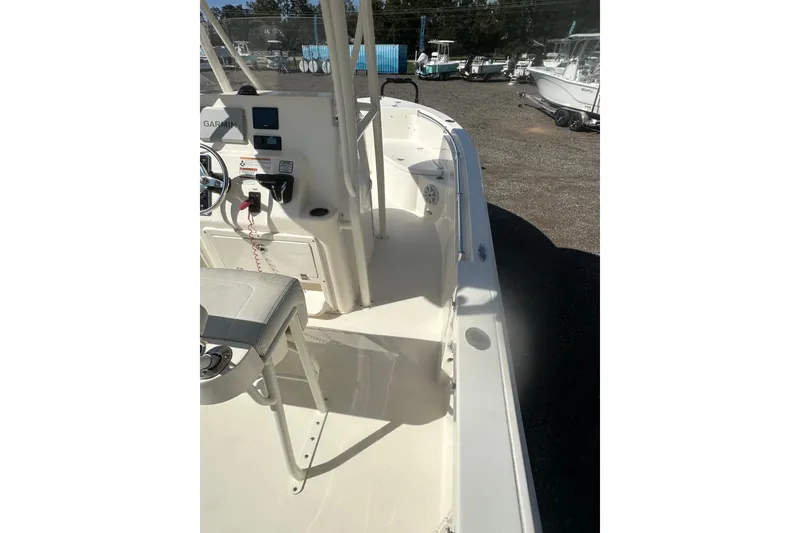 Slide: The Image of 2023 Cobia 220 Center Console boat interior with steering console and seating. - 20