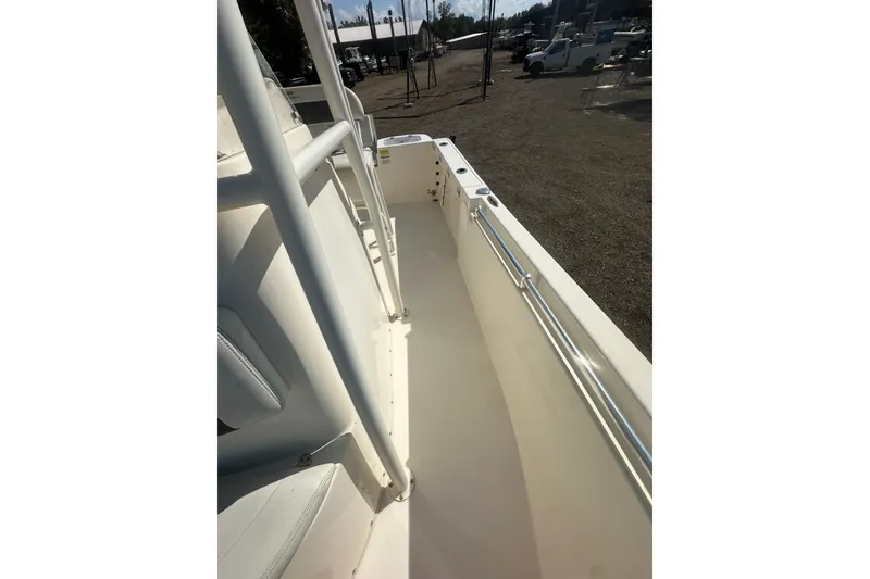 Slide: The Image of 2023 Cobia 220 Center Console boat interior with sleek design and sturdy railings. - 24