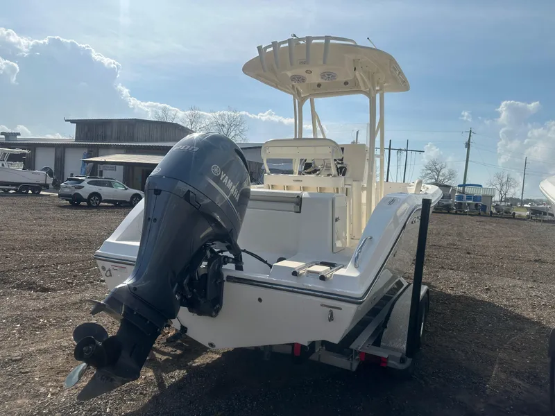 Slide: The Image of 2023 Cobia 220 CC boat with Yamaha outboard motor on a trailer. - 5