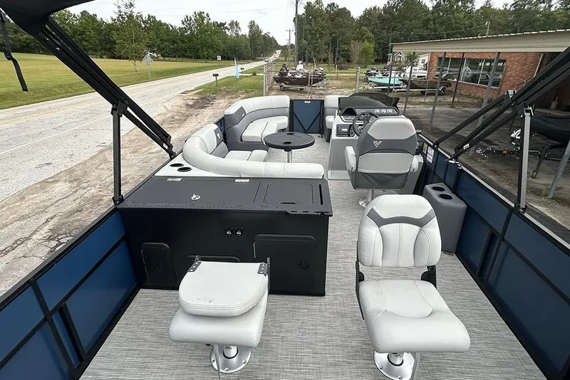 Slide: The Image of 2025 Viaggio Lago V-R pontoon boat interior with modern seating and steering console. - 10