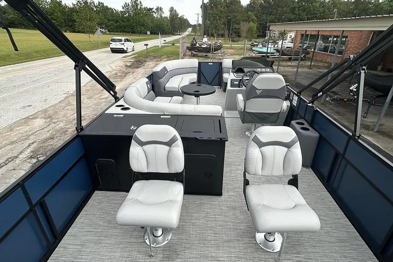 Slide: The Image of Interior of 2025 Viaggio Lago V-R pontoon boat with modern seating and steering console. - 11