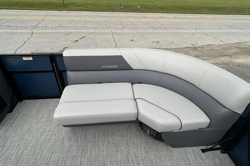 Slide: The Image of 2025 Viaggio Lago V-R boat with sleek gray seating on a textured deck. - 19