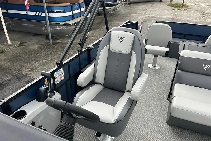 Slide: The Image of 2025 Viaggio Lago V-R boat interior with gray seating and steering wheel. - 24