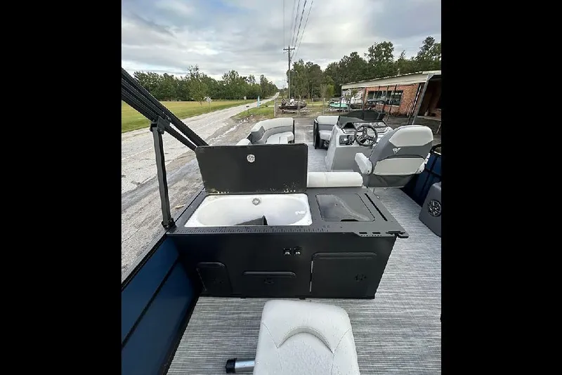 Slide: The Image of 2025 Viaggio Lago V-R boat interior with seating and open storage compartment. - 27