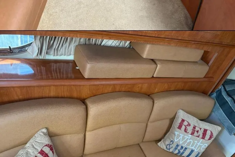 Slide: The Image of Interior of 2006 Four Winns 318 Vista boat with beige seating and decorative pillows. - 4
