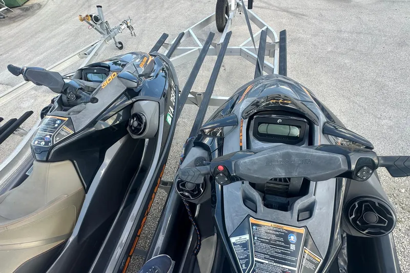Slide: The Image of 2021 Sea-Doo GTX 300 jet skis on a trailer, ready for transport. - 5