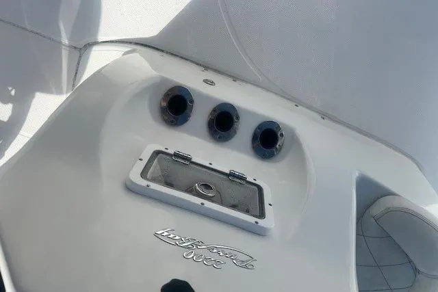 Slide: The Image of 2019 Blue Wave 2200 PureBay boat dashboard with control panel and storage compartment. - 12