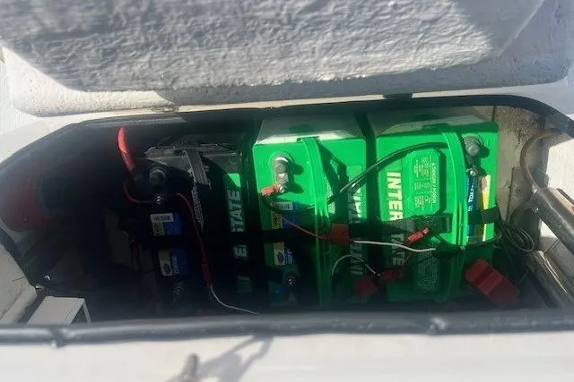 Slide: The Image of 2019 Blue Wave 2200 PureBay boat battery compartment with green Interstate batteries. - 13