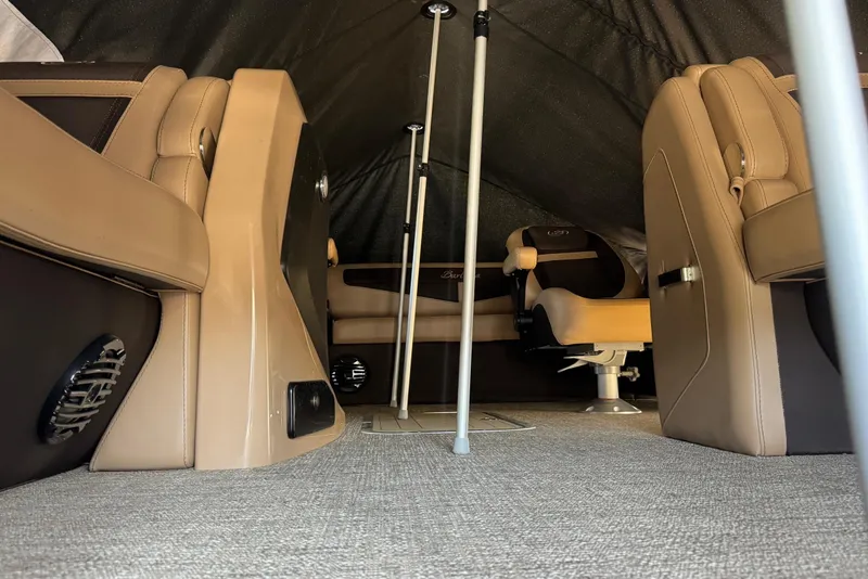 Slide: The Image of Interior of 2023 Barletta Cabrio 22UC boat with tan seating and carpeted floor. - 12