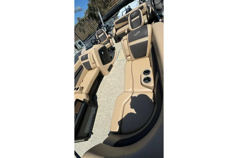 Slide: The Image of 2023 Barletta Cabrio 22UC boat interior with tan seating and cup holders. - 18