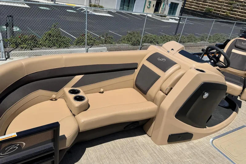 Slide: The Image of 2023 Barletta Cabrio 22UC boat interior with tan and black seating. - 20