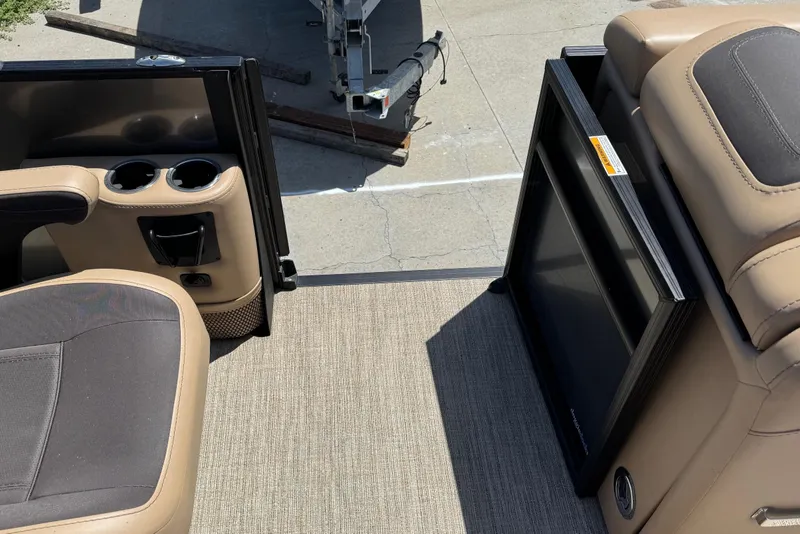 Slide: The Image of 2023 Barletta Cabrio 22UC interior with cup holders and seating. - 23