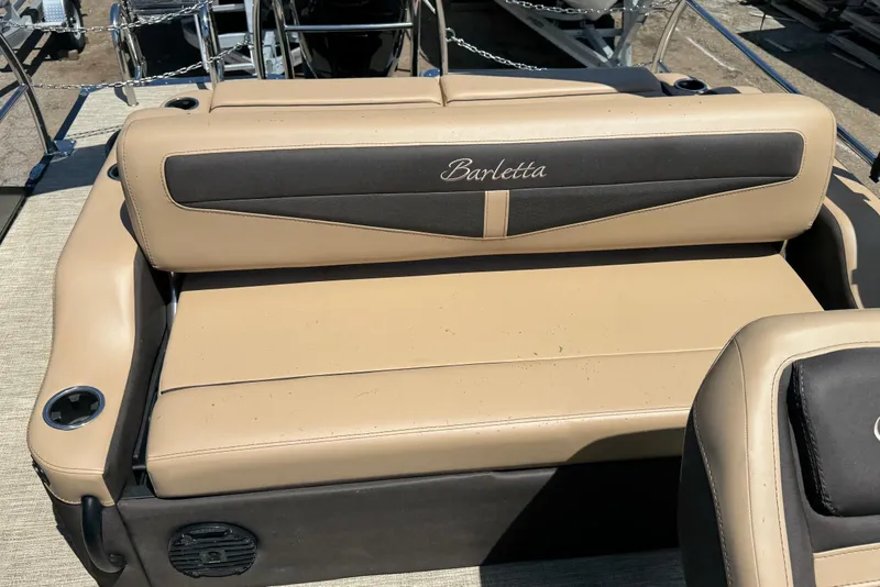 Slide: The Image of 2023 Barletta Cabrio 22UC boat seating with beige and black upholstery. - 24