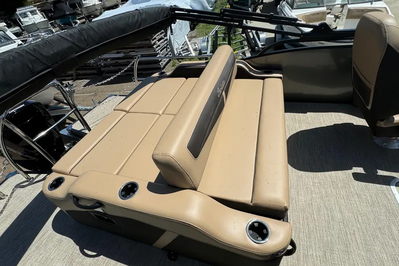 Slide: The Image of 2023 Barletta Cabrio 22UC boat interior with tan seating and cup holders. - 28