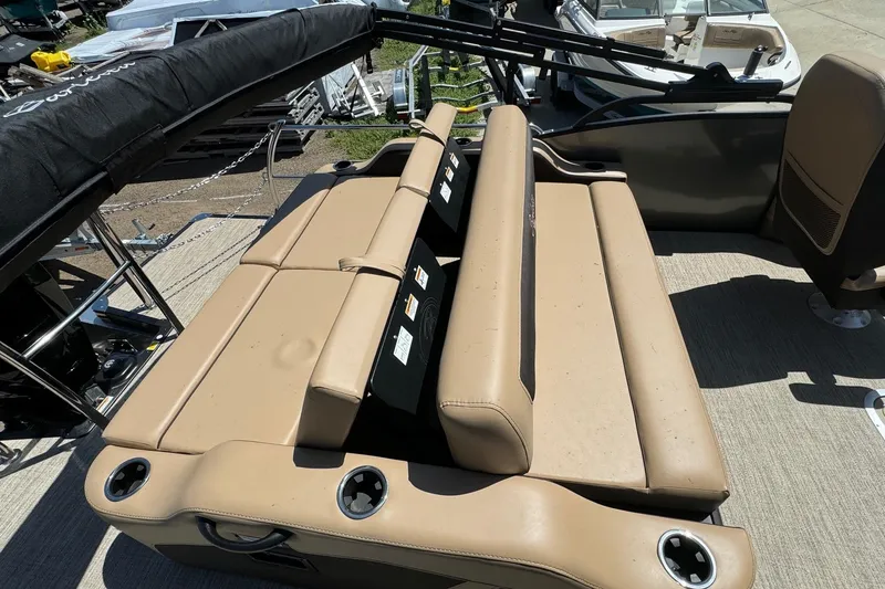 Slide: The Image of 2023 Barletta Cabrio 22UC boat interior with tan seating and cup holders. - 29