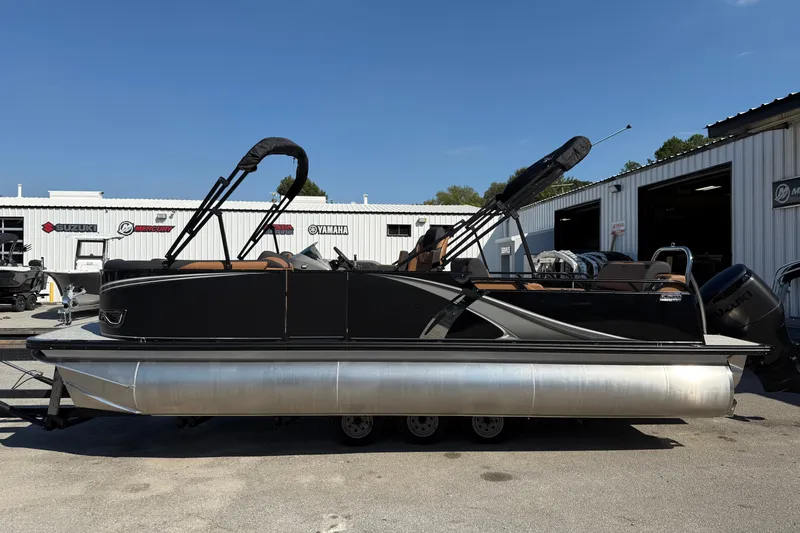 The Image of 2026 Tahoe Pontoon LTZ Versatile Rear Lounger, silver exterior, parked outdoors. - 0