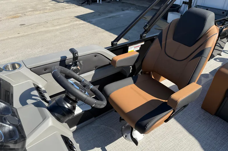 Slide: The Image of 2026 Tahoe Pontoon LTZ Versatile Rear Lounger with beige seating and stainless steel railings. - 10
