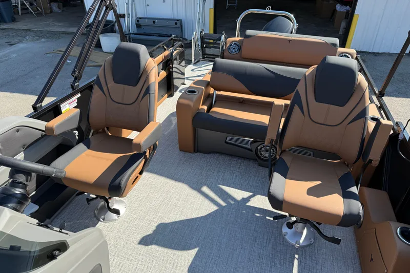 Slide: The Image of 2026 Tahoe Pontoon LTZ Versatile Rear Lounger with beige seating and cup holders. - 11