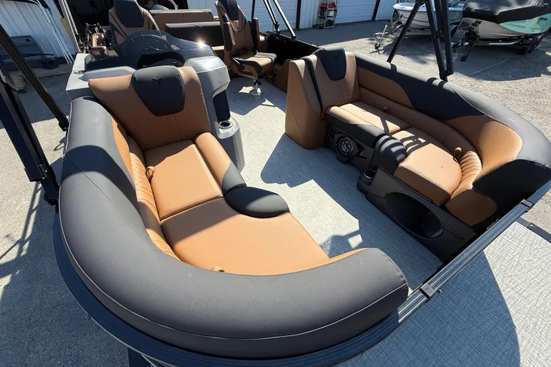 Slide: The Image of 2026 Tahoe Pontoon LTZ Versatile Rear Lounger with Suzuki outboard motor and boarding ladder. - 14