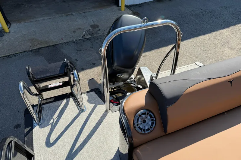 Slide: The Image of 2026 Tahoe Pontoon LTZ Versatile Rear Lounger with beige seating and cup holders. - 4