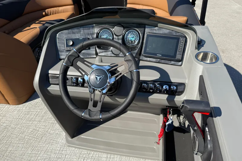 Slide: The Image of 2026 Tahoe Pontoon LTZ Versatile Rear Lounger with beige seating and integrated speakers. - 7