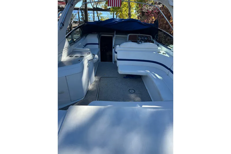 Slide: The Image of 2004 Formula 330 Sun Sport boat interior with seating and control panel. - 10