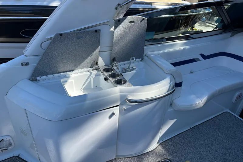 Slide: The Image of 2004 Formula 330 Sun Sport boat interior with sink and seating area. - 11