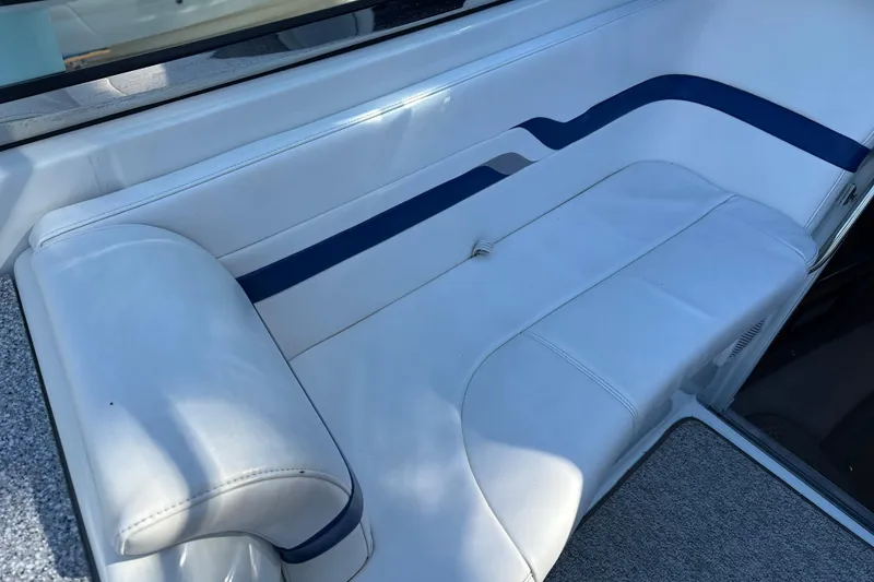 Slide: The Image of White and blue seating on a 2004 Formula 330 Sun Sport boat. - 16