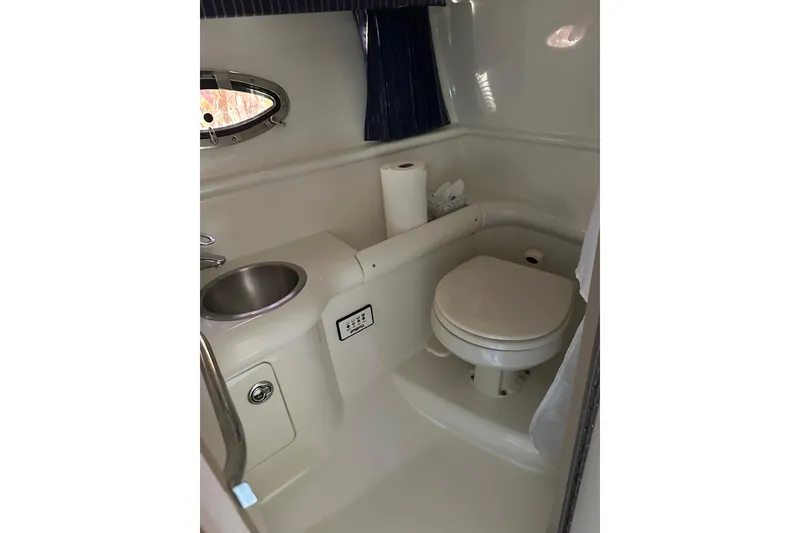 Slide: The Image of 2004 Formula 330 Sun Sport boat bathroom with sink and toilet. - 21