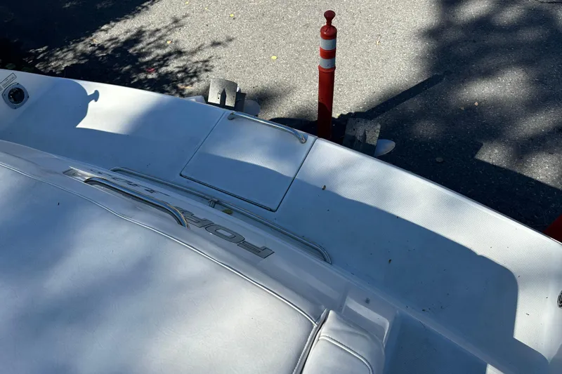 Slide: The Image of 2004 Formula 330 Sun Sport boat on trailer, partial view, outdoor setting. - 5