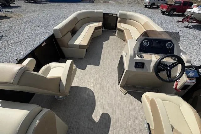 Slide: The Image of 2026 Veranda VISTA VIEW 22RC pontoon boat interior with beige seating and steering console. - 11