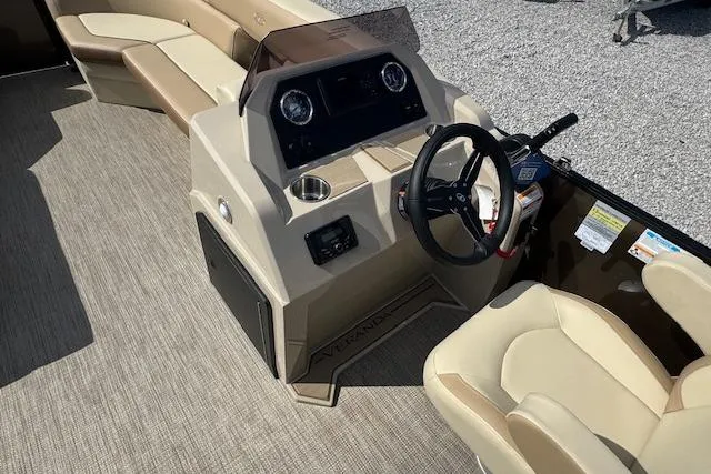 Slide: The Image of 2026 Veranda VISTA VIEW 22RC boat interior with steering console and beige seating. - 7
