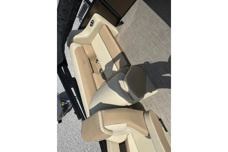 Slide: The Image of 2026 Veranda VISTA VIEW 22RC boat interior with beige seating and cup holders. - 9